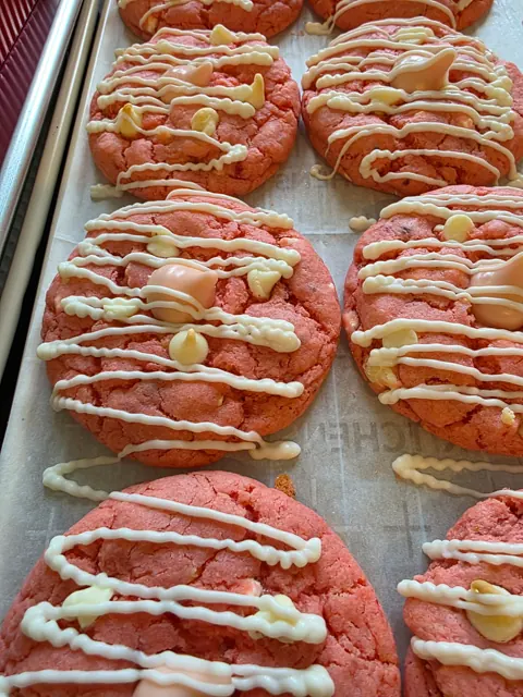 Pink cookies with a finishing drizzle