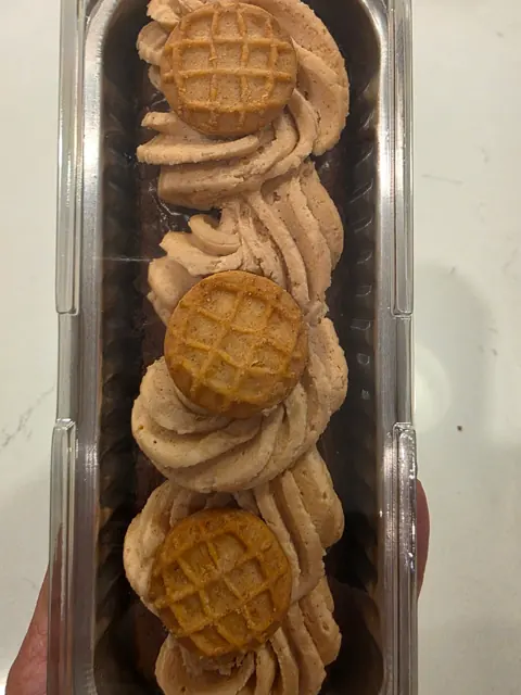 A chocolate loaf with cookie-topped frosting
